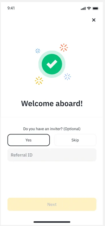 Binance app “Welcome aboard!” screen: a green tick, the question “Do you have an inviter? (Optional)” with Yes and Skip, a Referral ID field and a yellow Next button